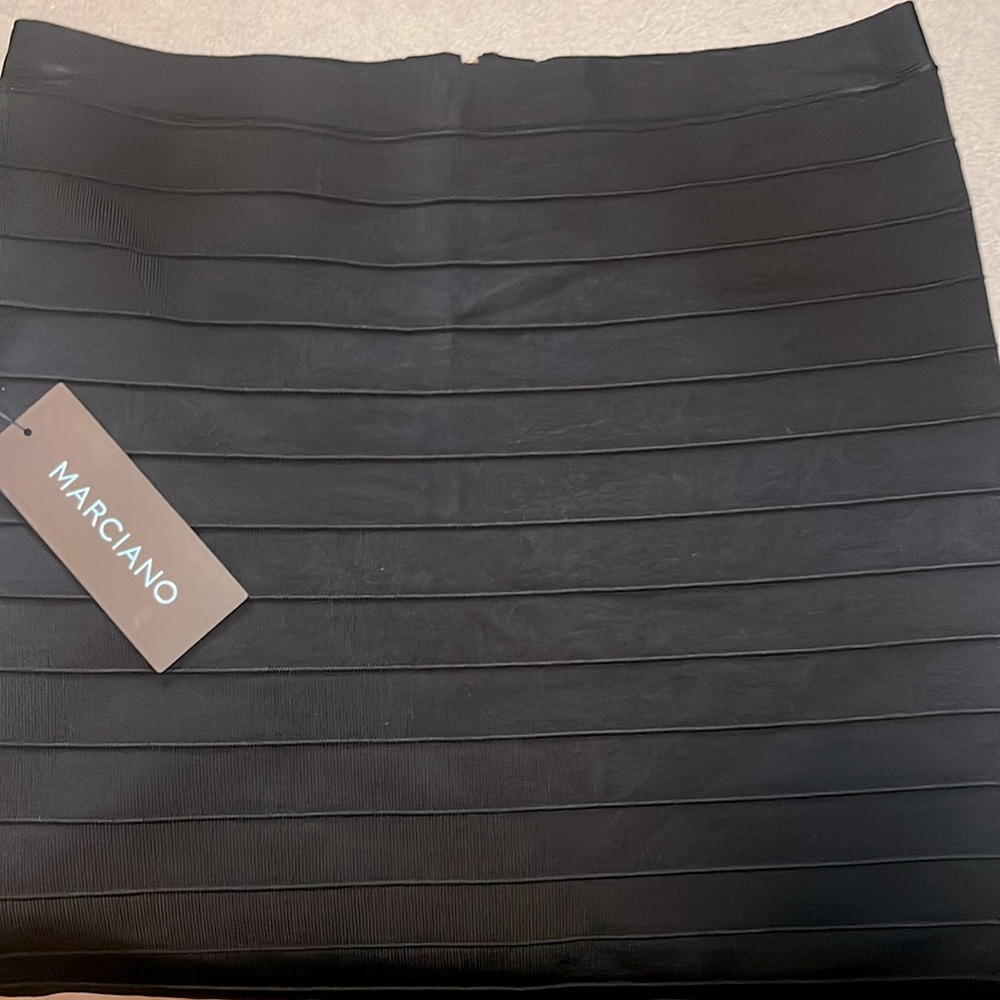NEW Knee-length black bandage skirt with gold zipper on back or side.
